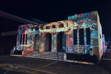 old pioneer shire building with a projection on the it