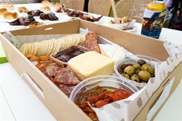 A tray of cheese and nibbles 